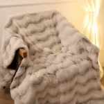 White faux fur throw draped over armchair