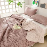 Cozy pink plaid comforter and pillows