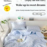 Light blue floral summer quilt on bed