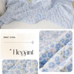 Light blue floral quilted bedspread and pillows
