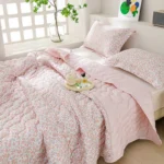 Pink floral bedding in bright bedroom