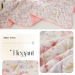 Pink floral quilted comforter on bed