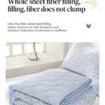 Folded blue floral quilt and pillow