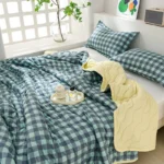 Green gingham bedding with yellow quilted throw