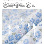Soft blue floral bedding fabric close-up