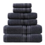 Stack of dark gray towels with striped accents.